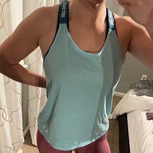 Light Blue Nike woman’s workout top